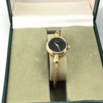 A Ladies Gucci watch model number 2700.2.L with box and papers. In ver good condition. Postage B