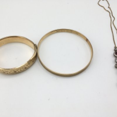 Two 9ct metal core bangles and a necklace. Postage B