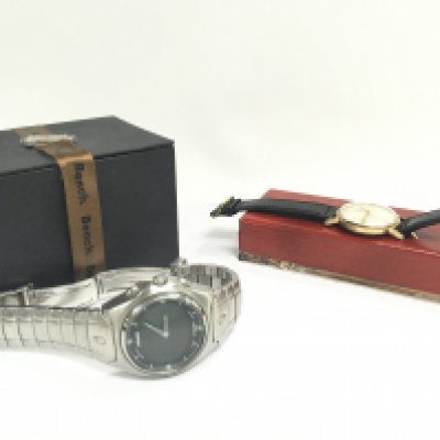 Two gents watches including a boxed Rodania watch and a Nixon watch. Postage category B