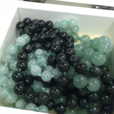 Three Jade necklaces. Postage category A