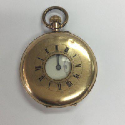 A 14 ct gold button wind half hunter pocket watch the enamel dial with second subsidiary dial .