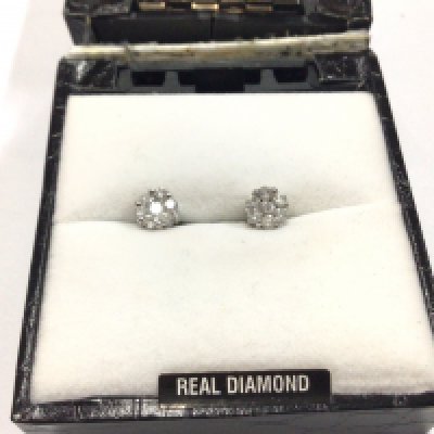 A pair of diamond cluster earrings.