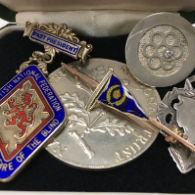 A 9ct gold and enamel flag brooch 3.3g in total, an enamelled Scottish National Federation for the blind brooch and some silver items. Postage category a.