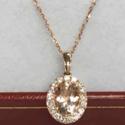 9ct rose gold oval morganite and RBC diamond cluster pendant on a 9ct rose gold chain, boxed. Morganite 1.10ct. Diamonds 0.28ct. Postage category A.