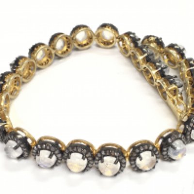 Rainbow moonstone and diamond articulated bracelet, boxed. Cabochon moonstones 14.35ct. Rose cut diamonds 2.75ct. Silver gilt. Postage category A.