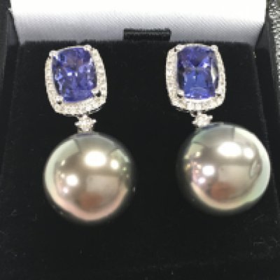 Pair of 18ct white gold earrings set with tanzanites, diamonds and suspended grey pearls, boxed. Rectangular cushion cut tanzanites 3.24ct. RBC diamonds 0.27ct. Postage category A.
