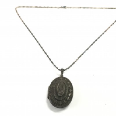 A silver Birmingham hallmarked locket & chain, postage category A