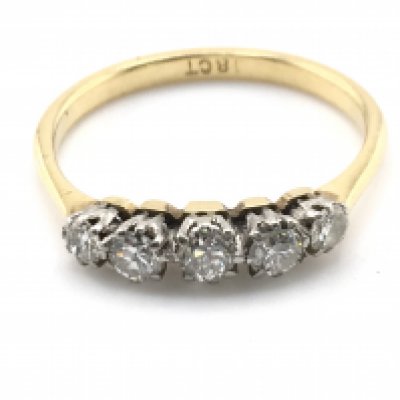 A 5 stone graduated 18ct gold ring. Size R and 2.68gPostage A