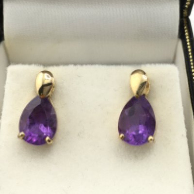 A pair of 9ct gold and amethyst earrings. Postage B