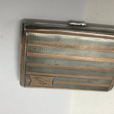 A silver cigarette case 97 grams