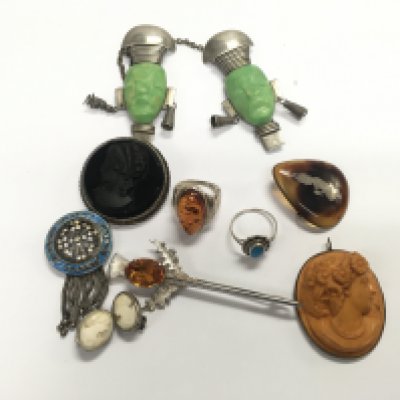 A mixed collection of silver and silver plated jewellery, including some cameo brooches earrings and other items.