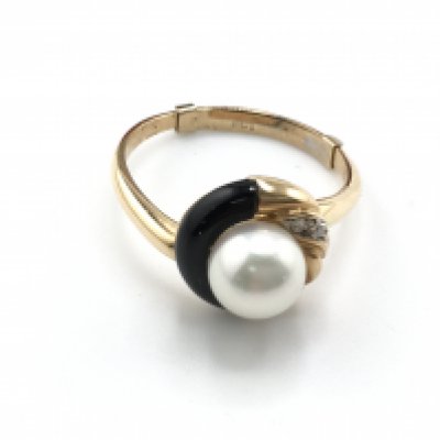 A modern design 18carat gold ring with matching earrings set with pearl and small diamonds.weight 7.5g