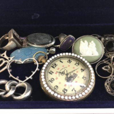 A collection of silver and white metal jewellery including a Wedgwood brooch, pendants, rings etc