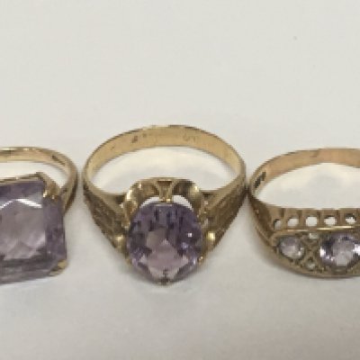 Three gold rings two marked 9carat 375 all three rings set with cut amethyst stones. Total weight 7g (3)