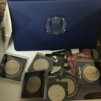 A box containing commemorative crowns and boxed Decimal sets and other coins