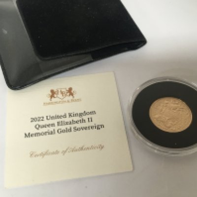 A 2022 gold proof memorial Sovereign depicting King Charles III with COA.