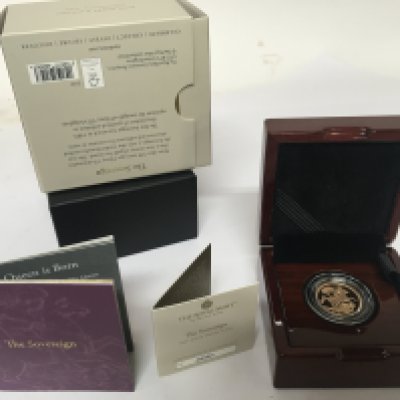 A 2021gold proof sovereign in a fitted Royal Mint box with outer box and paperwork COA.