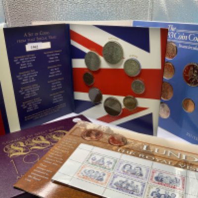 A small collection of presentation and proof coin collections.