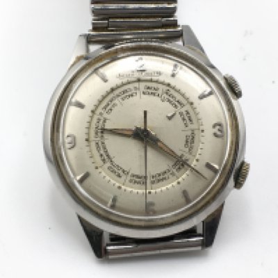 Vintage Jaeger LeCoultre Momovox world timer wrist watch. Winds and runs. The alarm function also winds and goes off. Approximately 36mm case. Postage B