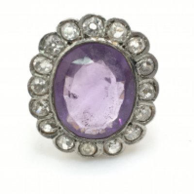 A large cocktail ring with Amethyst and diamond. Size O. Postage B