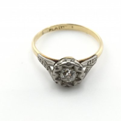 An 18ct gold and platinum ring sent with small diamond. Size M and 1.93g Postage A