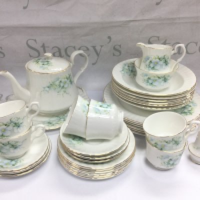 A Royal Stafford bone china tea and dinner set plus a Czechoslovakian tea set with floral spray decoration. Shipping category D. NO RESERVE