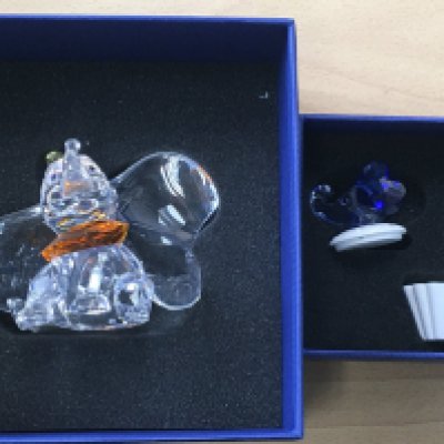 A Boxed Swarovski Disney figure of Dumbo, together with a trinket box with an blue coloured elephant head on the lid