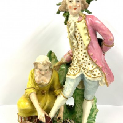 A Bloor Derby group figure of a shoeblack modelled as a girl polishing the shoes of a gentleman, 17cm, marked No.81, c.1820. (D) NO RESERVE