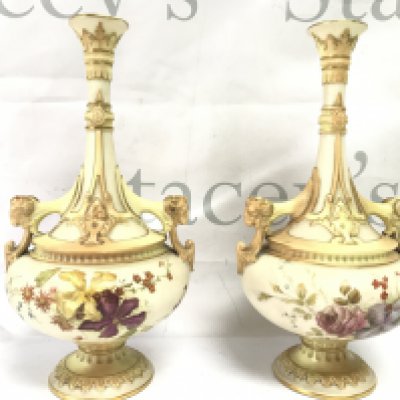A pair of Royal Worcester vases with floral decoration and goats heads handles and a pair of Worcester shell dishes . This lot cannot be posted
