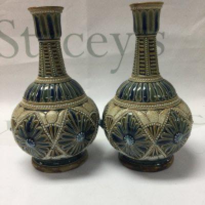A pair of Doulton Lambeth vases by Edith Lupton decorated with flower heads. 16 cm .