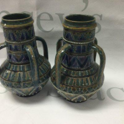 A pair of Doulton Lambeth four handled vases 14 cm .
