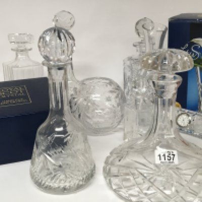 A collection of cut glass decanters and other glassware including Royal Scot Crystal.