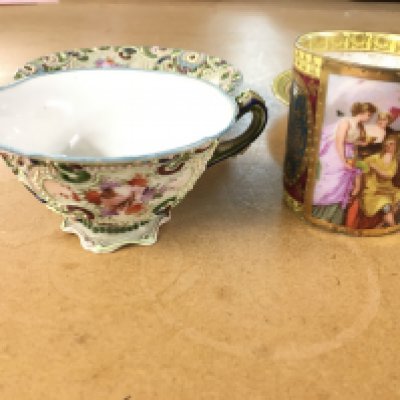 A Vienna coffee cup and saucer together with an early Noritake cup and saucer. Hairline to noritake cup otherwise good.