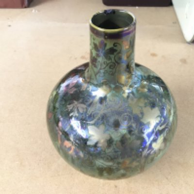 Richard Joyce Pilkington Royal Lancastrian luster vase with leaves. Hairline crack and chip to rim. 17cm tall.