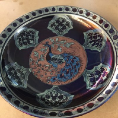 A Hege Jonathan Chiswell Jones Peacock lustre charger. 39cm diameter
