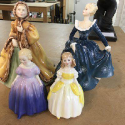 A Collection of four Doulton figures.