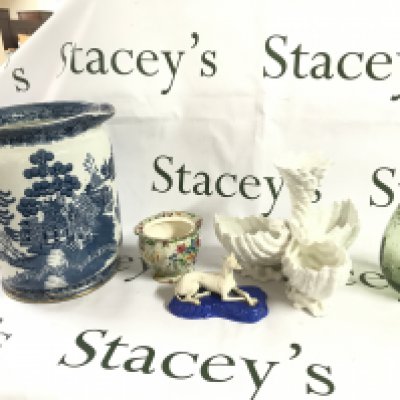 A Collection of ceramics including a Green art glass vase, white ceramic flower vase, Copeland & Garrett dog figure, Royal Winton vase, Cetem ware blue and white large jug . this lot cannot be posted