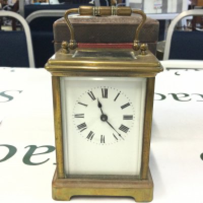 WITHDRAWN - A wooden and leather cased carriage clock (11cm tall) , made in France. This lot cannot be posted. NO RESERVE