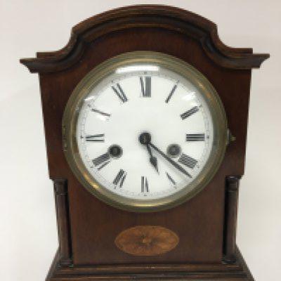 An Edwardian inlaid mahogany mantel clock with an enamel dial brass movement striking on a gong with pendulum height 32cm