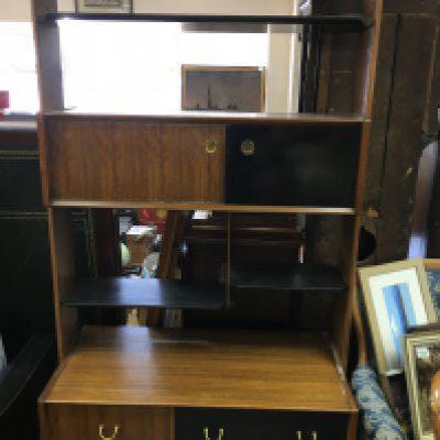 A 1970s Harlequin open bookcase fitted with cupboards and doors.