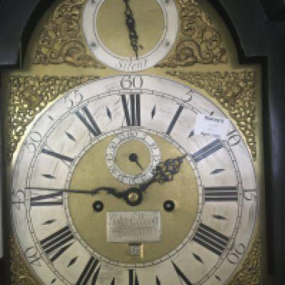 A mid 18th Century long case clock in a black finish case maker John Ellicott London (1706-1770) the brass dial with maker silvered plaque and conforming chapter ring strike and silent subsidiary dial with weights and pendulum eight day going movement the clock appears to be u. Good condition. Height 230cm