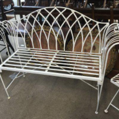 A Regency style wrought iron folding garden seat and one other folding garden seat (2)