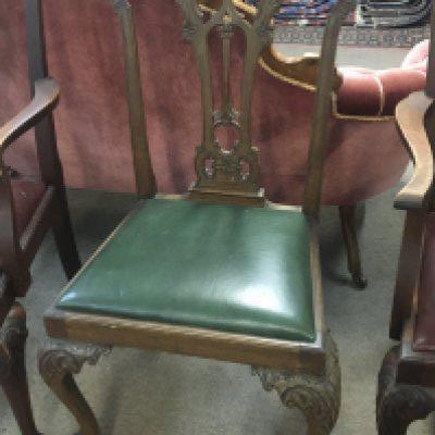 A late George III mahogany dining chair with a shaped back and drop in seat and three similar mahogany dining chairs (4&#2013266057۪