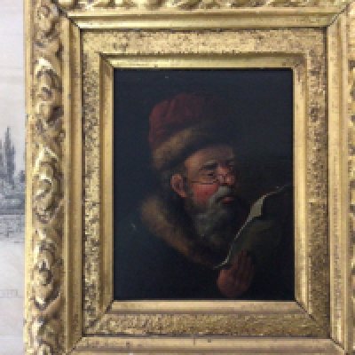 A small framed 19th century oil painting on panel portrait of a Continental figure reading a paper. A retrospective oil painting study of Dutch sailing ships and other oddments.