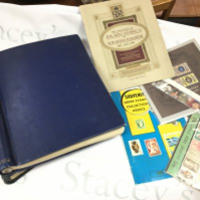 A collection of UK & World stamps including two albums , used and unused . Postage category C