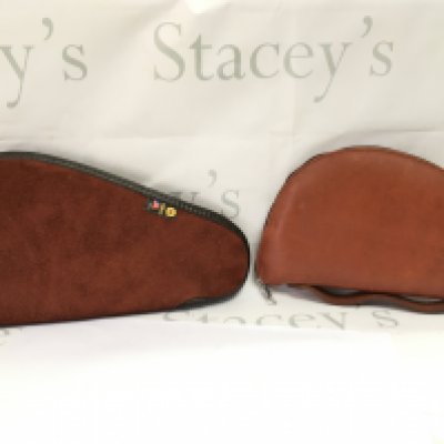 Two leather and sheep skin pistol cases. postage category B
