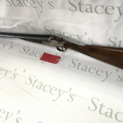 A black Sabel DeLuxe side by side 12g shotgun. 26.75inch barrel and 44.5inches overall length. Twin trigger. A great example of a classic side lock action with removable side plate. PLEASE NOTE THAT A SHOTGUN LICENSE IS REQUIRED TO PURCHASE THIS ITEM. VIEWING AND COLLECTING IS BY APPOINTMENT ONLY.