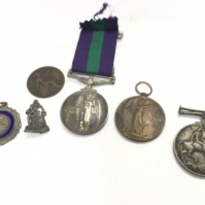A British General Service medal with Cyprus bar presented to 5048190 A.C.2 E.R Kirby R.A.F, Two WW1 presented to L-1113 DVR.C.A Bridges .R.A including a defence medal and a victory medal. A circa 1920s vintage The Raleigh Cycle Company promotional/advertising pin badge . Trench art WW1 needlework Postage category A