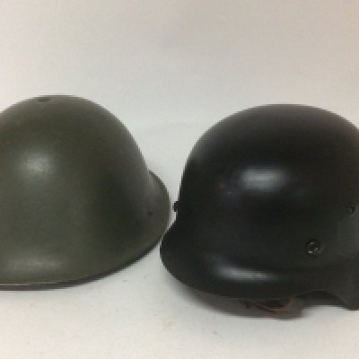 A British Military Hat 1977 M.W.S and a German Third Reich type black painted helmet with a white liner and stamped 3273 (2)- NO RESERVE