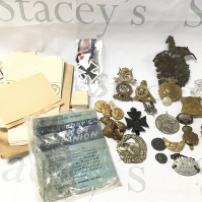 A Collection of Military Cap Badges.Buttons. A Dog Tag. Etc. Some Are Replicas. No Reserve.